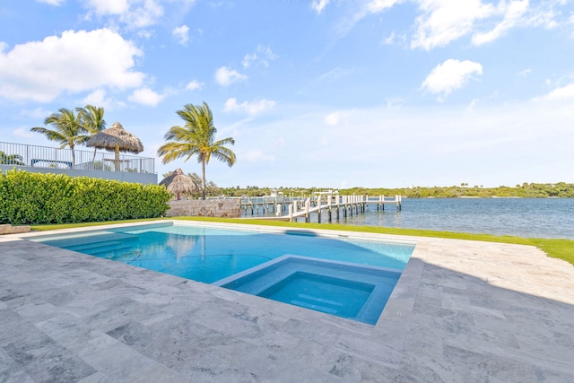 18119 SE Federal Hwy, Tequesta, FL 33469 - outdoor pool featuring an in-ground hot tub, a patio, a water view, and a dock