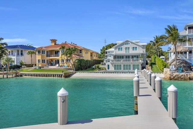 18119 SE Federal Hwy, Tequesta, FL 33469 - water view featuring a boat dock and nearby suburban area