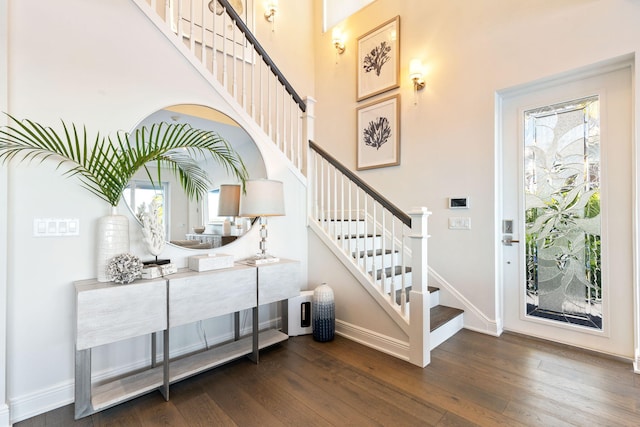 18119 SE Federal Hwy, Tequesta, FL 33469 - stairway featuring wood-type flooring, baseboards, and a high ceiling