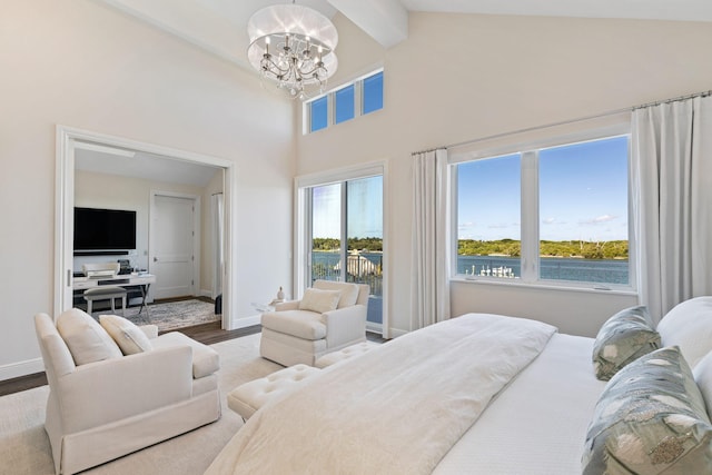 18119 SE Federal Hwy, Tequesta, FL 33469 - bedroom featuring a chandelier, beamed ceiling, wood finished floors, high vaulted ceiling, and baseboards