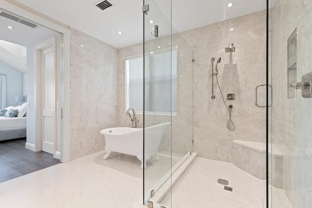 18119 SE Federal Hwy, Tequesta, FL 33469 - bathroom with a freestanding bath, a stall shower, ensuite bathroom, wood finished floors, and recessed lighting