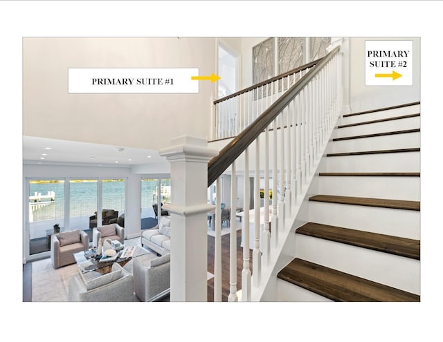 18119 SE Federal Hwy, Tequesta, FL 33469 - stairway featuring a towering ceiling and recessed lighting