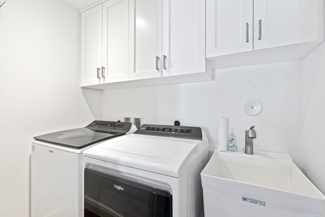 18119 SE Federal Hwy, Tequesta, FL 33469 - laundry area featuring cabinet space and washer and clothes dryer