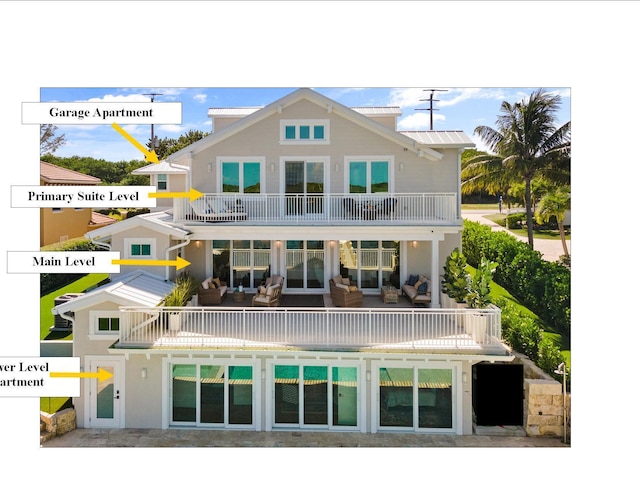 18119 SE Federal Hwy, Tequesta, FL 33469 - rear view of property featuring a balcony and an outdoor living space