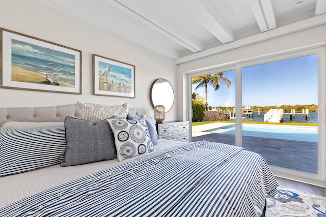 18119 SE Federal Hwy, Tequesta, FL 33469 - bedroom featuring access to exterior, beamed ceiling, and wood finished floors