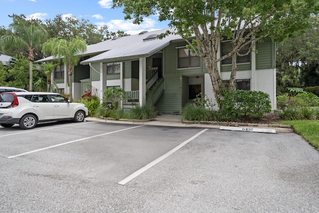5200 SE Seascape Way Unit 201, Stuart, FL 34997 - view of building exterior featuring uncovered parking and stairs