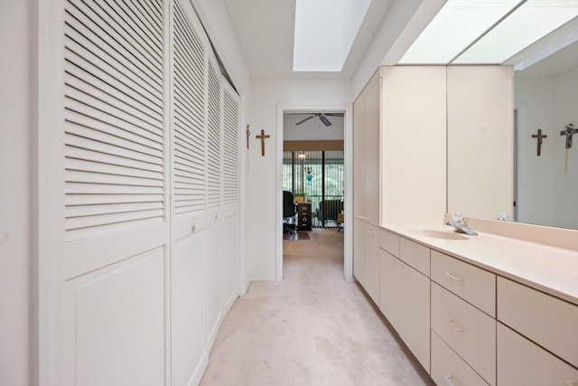 5200 SE Seascape Way Unit 201, Stuart, FL 34997 - hall with a sink, light carpet, and a skylight