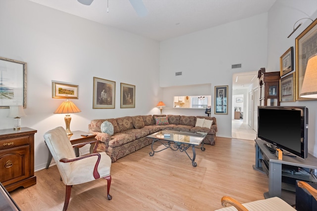 5200 SE Seascape Way Unit 201, Stuart, FL 34997 - living area featuring ceiling fan, a high ceiling, and wood finished floors