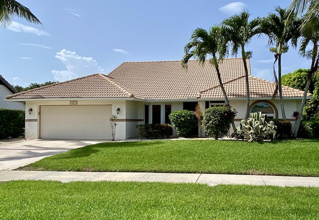 18531 Anchor Dr, Boca Raton, FL 33498 - view of front facade featuring an attached garage, stucco siding, a front yard, and a tile roof