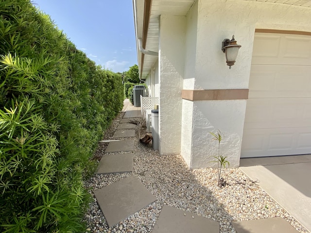 18531 Anchor Dr, Boca Raton, FL 33498 - view of home's exterior featuring stucco siding and central air condition unit