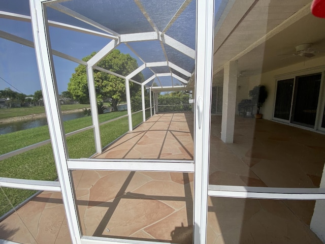 18531 Anchor Dr, Boca Raton, FL 33498 - unfurnished sunroom featuring a water view and a ceiling fan