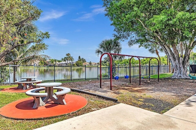 18531 Anchor Dr, Boca Raton, FL 33498 - communal playground featuring a water view and a patio area