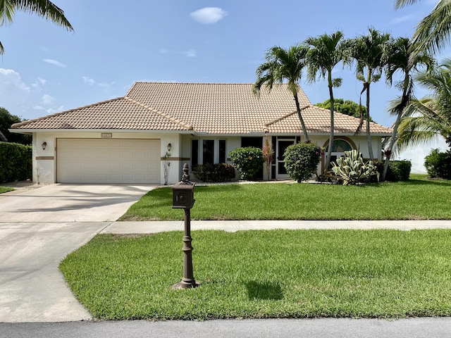 18531 Anchor Dr, Boca Raton, FL 33498 - ranch-style house with stucco siding, an attached garage, a tile roof, and concrete driveway