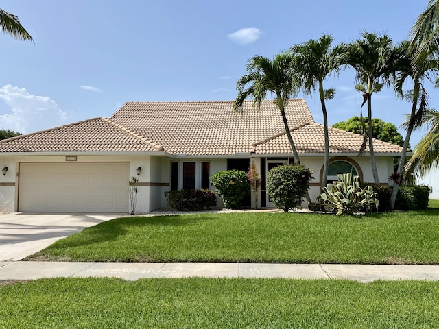 18531 Anchor Dr, Boca Raton, FL 33498 - ranch-style house featuring an attached garage, stucco siding, a front yard, and concrete driveway