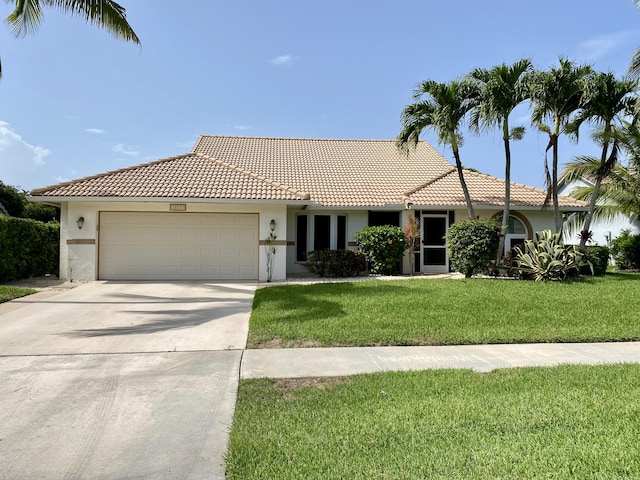 18531 Anchor Dr, Boca Raton, FL 33498 - ranch-style house with stucco siding, a garage, and a tiled roof
