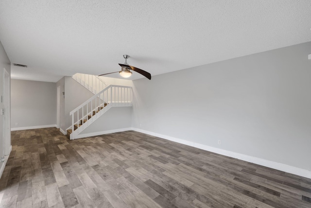 3665 Sliver Lace Ln Unit 80, Boynton Beach, FL 33436 - empty room featuring stairs, wood finished floors, ceiling fan, baseboards, and a textured ceiling