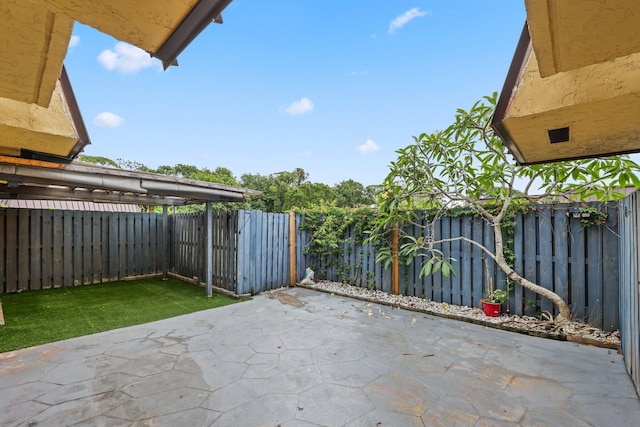 3665 Sliver Lace Ln Unit 80, Boynton Beach, FL 33436 - fenced backyard with a patio