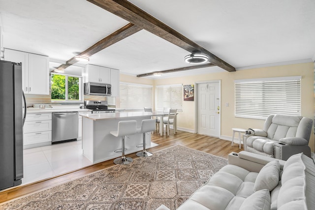 2020 Lake Osborne Dr Unit 10, Lake Worth, FL 33461 - living area with light wood finished floors and beam ceiling