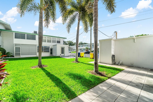 2020 Lake Osborne Dr Unit 10, Lake Worth, FL 33461 - view of grassy yard with a patio