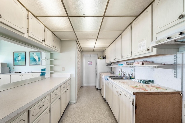 2020 Lake Osborne Dr Unit 10, Lake Worth, FL 33461 - kitchen with light countertops, a drop ceiling, and freestanding refrigerator