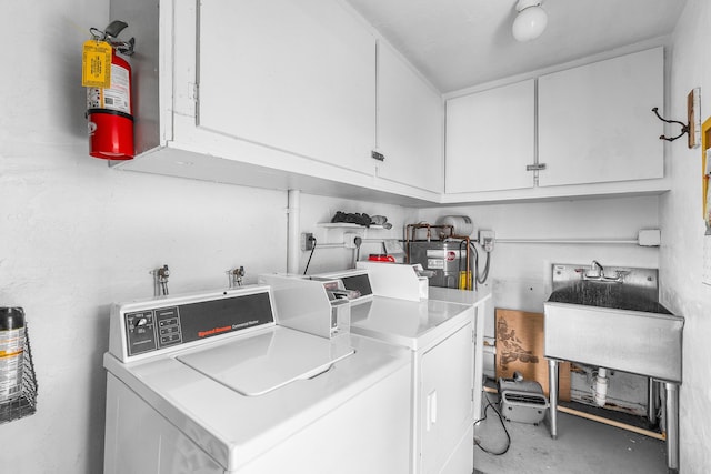 2020 Lake Osborne Dr Unit 10, Lake Worth, FL 33461 - laundry room featuring separate washer and dryer and water heater