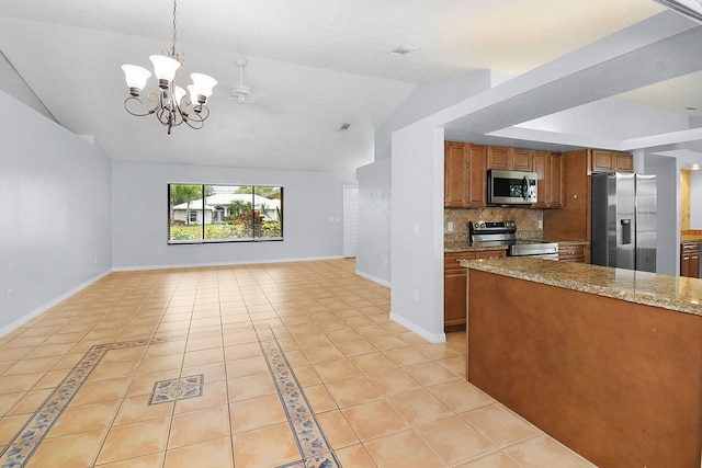 515 SE Nome Dr, Port Saint Lucie, FL 34984 - kitchen with appliances with stainless steel finishes, brown cabinetry, lofted ceiling, open floor plan, and light tile patterned flooring