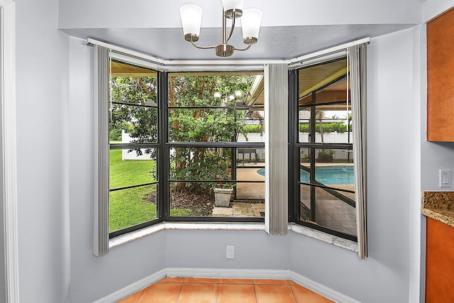 515 SE Nome Dr, Port Saint Lucie, FL 34984 - detailed view of a chandelier and baseboards