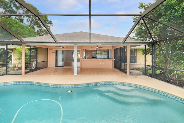 515 SE Nome Dr, Port Saint Lucie, FL 34984 - swimming pool with a ceiling fan, a patio area, and a lanai