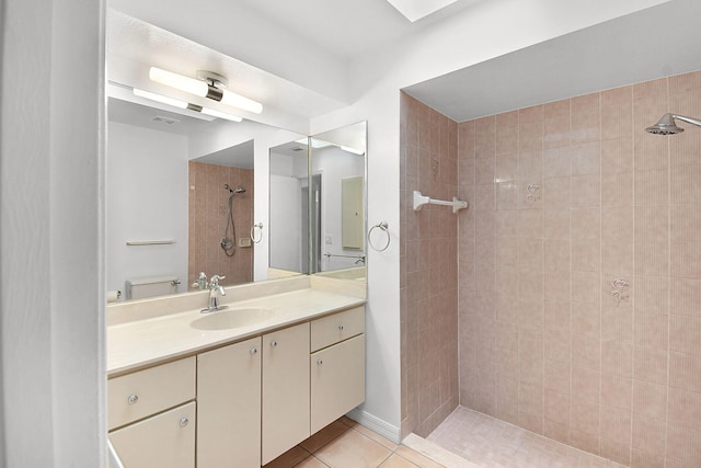 515 SE Nome Dr, Port Saint Lucie, FL 34984 - bathroom featuring a tile shower, vanity, and tile patterned flooring