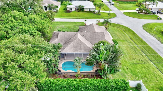 515 SE Nome Dr, Port Saint Lucie, FL 34984 - aerial view of property and surrounding area with a pool