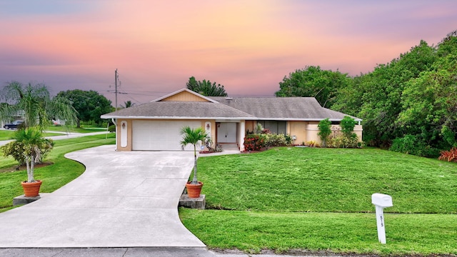 515 SE Nome Dr, Port Saint Lucie, FL 34984 - ranch-style house featuring concrete driveway, a yard, a garage, and roof with shingles