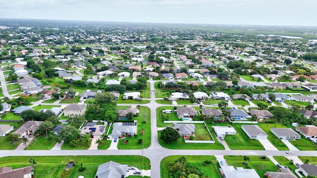 515 SE Nome Dr, Port Saint Lucie, FL 34984 - aerial view of property's location with nearby suburban area