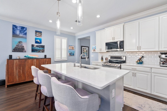 260 SE Via Visconti, Port Saint Lucie, FL 34952 - kitchen with appliances with stainless steel finishes, a sink, crown molding, backsplash, and dark wood-style floors