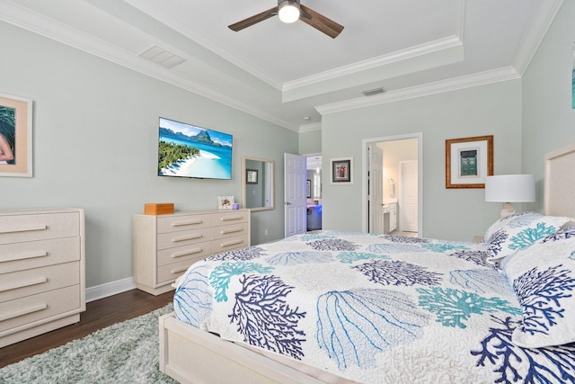 260 SE Via Visconti, Port Saint Lucie, FL 34952 - bedroom with dark wood finished floors, a tray ceiling, ornamental molding, ensuite bathroom, and ceiling fan