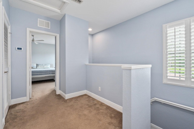 260 SE Via Visconti, Port Saint Lucie, FL 34952 - hallway with an upstairs landing, carpet flooring, attic access, and baseboards
