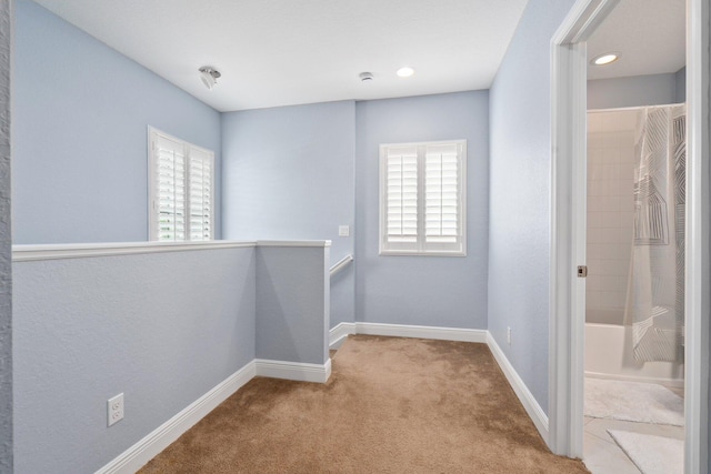 260 SE Via Visconti, Port Saint Lucie, FL 34952 - spare room with plenty of natural light, carpet, baseboards, and recessed lighting