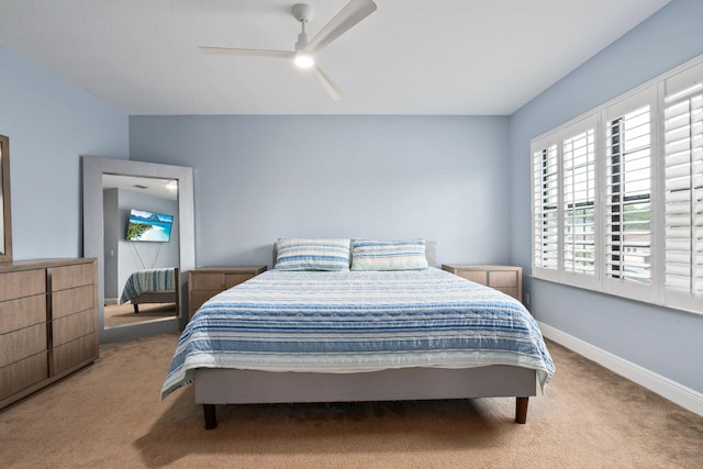 260 SE Via Visconti, Port Saint Lucie, FL 34952 - bedroom featuring carpet floors, a ceiling fan, and baseboards
