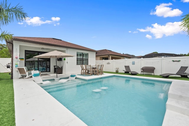 260 SE Via Visconti, Port Saint Lucie, FL 34952 - view of pool with a fenced backyard, an outdoor living space, a patio area, and outdoor dining space