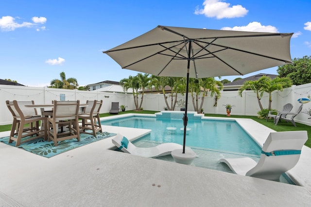260 SE Via Visconti, Port Saint Lucie, FL 34952 - view of swimming pool featuring a fenced backyard, a patio area, and outdoor dining area