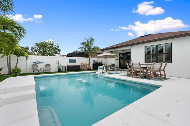 260 SE Via Visconti, Port Saint Lucie, FL 34952 - view of pool with a fenced backyard, a patio area, a ceiling fan, and outdoor dining area