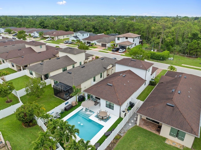260 SE Via Visconti, Port Saint Lucie, FL 34952 - aerial view of residential area with a pool and a forest