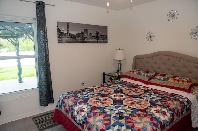 1122 SW California Blvd SW, Port Saint Lucie, FL 34953 - bedroom featuring wood finished floors and baseboards