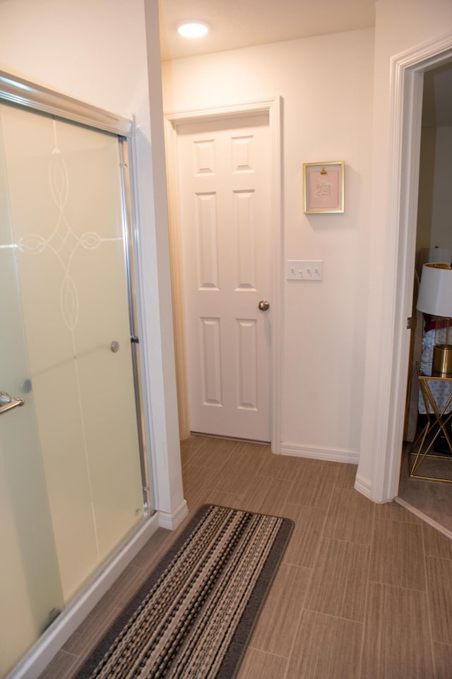 1122 SW California Blvd SW, Port Saint Lucie, FL 34953 - bathroom with a stall shower and baseboards