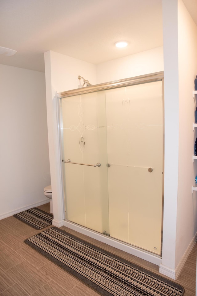 1122 SW California Blvd SW, Port Saint Lucie, FL 34953 - bathroom with a shower stall, toilet, and baseboards
