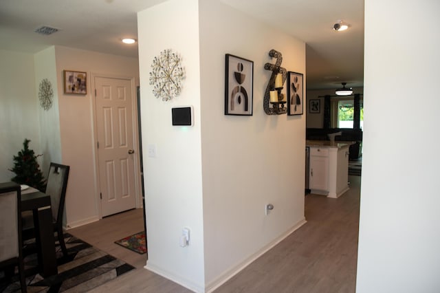 1122 SW California Blvd SW, Port Saint Lucie, FL 34953 - hallway with light wood finished floors and baseboards