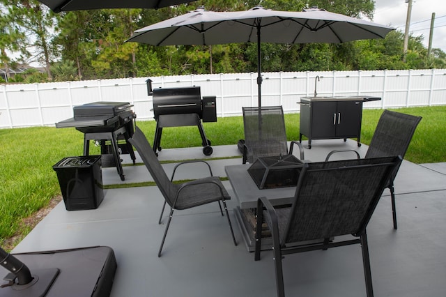 1122 SW California Blvd SW, Port Saint Lucie, FL 34953 - view of patio featuring outdoor dining space