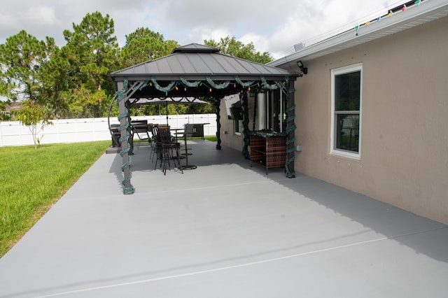 1122 SW California Blvd SW, Port Saint Lucie, FL 34953 - view of patio / terrace with a gazebo and outdoor dining space