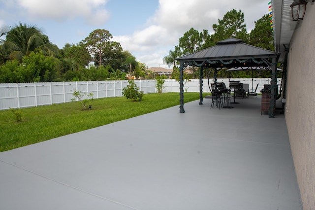 1122 SW California Blvd SW, Port Saint Lucie, FL 34953 - view of patio with a gazebo and outdoor dining area