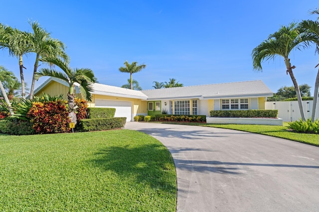 4633 Holly Dr, Palm Beach Gardens, FL 33418 - single story home with an attached garage and concrete driveway