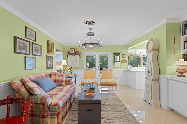 4633 Holly Dr, Palm Beach Gardens, FL 33418 - living area with a wainscoted wall, a chandelier, french doors, crown molding, and a decorative wall